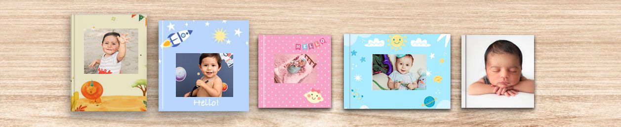 Design interface for creating a baby photo album online on a laptop, perfect for curating a special 1st birthday gift.