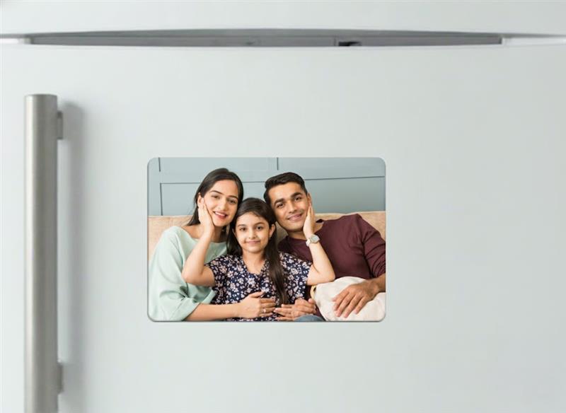 Fridge magnets displaying multiple family photos, with rounded corners and a matte finish for a sleek, modern look.