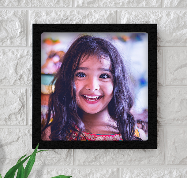 Cheerful child's portrait in a photo frame online showcase