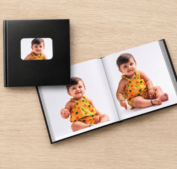 Personalized leather baby photo book with custom title and baby photos, designed to capture early moments in a lasting keepsake