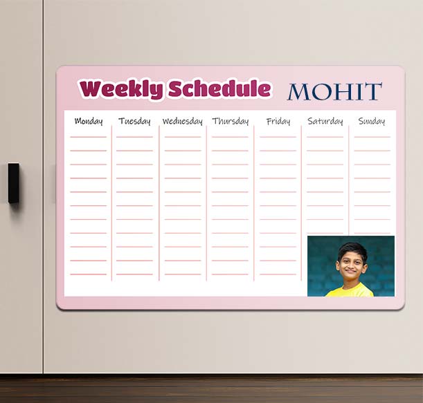 Customized pink magnetic weekly planner with a child's photo on a wall