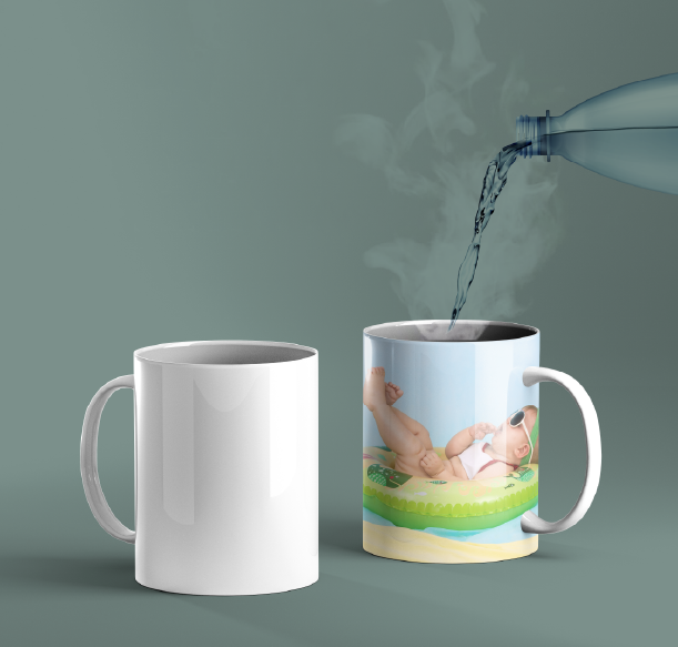 A plain and a customised mug in singapore with an image of a baby in a pool being filled with water 